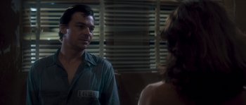 Movie still from “Assault on Precinct 13” (1976), directed by John Carpenter – A man and a woman are standing in front of each other; Close Up shot, Over the shoulder angle