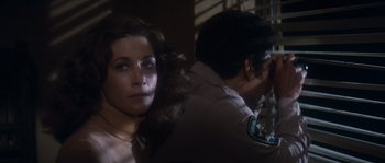 Movie still from “Assault on Precinct 13” (1976), directed by John Carpenter – A woman in a brown shirt and a man in a brown jacket; Close Up shot, Over the shoulder angle