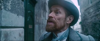 Movie still from “At Eternity's Gate” (2018), directed by Julian Schnabel – A person wearing a hat; Close Up shot, Over the shoulder angle