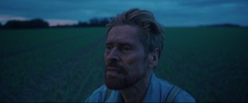Movie still from “At Eternity's Gate” (2018), directed by Julian Schnabel – A person in a field at night; Close Up shot, Low angle