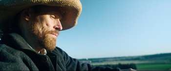 Movie still from “At Eternity's Gate” (2018), directed by Julian Schnabel – A person wearing a hat; Close Up shot, Low angle