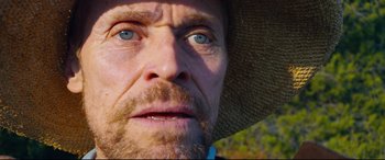 Movie still from “At Eternity's Gate” (2018), directed by Julian Schnabel – A person wearing a hat; Extreme Close Up shot, Low angle