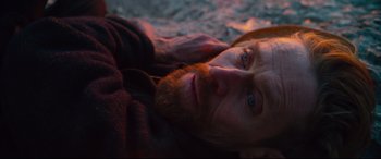 Movie still from “At Eternity's Gate” (2018), directed by Julian Schnabel – A person laying on the ground; Close Up shot, High angle