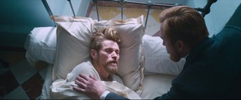 Movie still from “At Eternity's Gate” (2018), directed by Julian Schnabel – A man laying in a bed next to another man; Medium shot, Over the shoulder angle