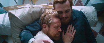 Movie still from “At Eternity's Gate” (2018), directed by Julian Schnabel – A couple of men sitting next to each other; Close Up shot, Overhead angle