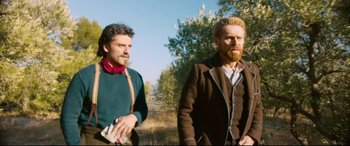 Movie still from “At Eternity's Gate” (2018), directed by Julian Schnabel – Two men standing next to each other on a field; Medium shot, Over the shoulder angle