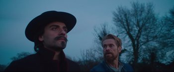 Movie still from “At Eternity's Gate” (2018), directed by Julian Schnabel – Two men standing next to each other near a tree; Close Up shot, Over the shoulder angle