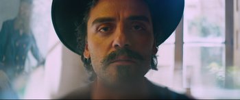 Movie still from “At Eternity's Gate” (2018), directed by Julian Schnabel – A person wearing a hat with a mustache; Close Up shot, Low angle