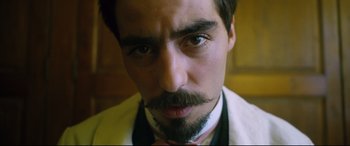 Movie still from “At Eternity's Gate” (2018), directed by Julian Schnabel – A person with a beard and mustache; Close Up shot, Low angle