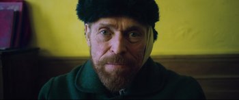 Movie still from “At Eternity's Gate” (2018), directed by Julian Schnabel – A person wearing a hat; Close Up shot, Low angle