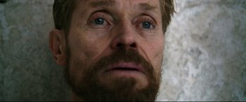 Movie still from “At Eternity's Gate” (2018), directed by Julian Schnabel – A man with a beard and blue eyes; Close Up shot, Over the shoulder angle