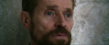 Movie still from “At Eternity's Gate” (2018), directed by Julian Schnabel – A man with a beard and mustache; Close Up shot, Over the shoulder angle