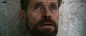 Movie still from “At Eternity's Gate” (2018), directed by Julian Schnabel – A man with a beard and blue eyes; Close Up shot, Low angle