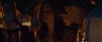 Movie still from “At First Light” (2018), directed by Jason Stone – A woman and a man in a dark room; Close Up shot, Over the shoulder angle