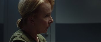 Movie still from “At First Light” (2018), directed by Jason Stone – A person with blonde hair; Close Up shot, Over the shoulder angle