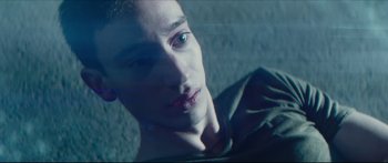 Movie still from “At First Light” (2018), directed by Jason Stone – A man with blue eyes looking into the distance; Close Up shot, Overhead angle