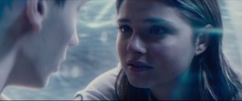 Movie still from “At First Light” (2018), directed by Jason Stone – A young woman's face in the water; Close Up shot, Over the shoulder angle