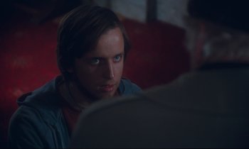 Movie still from “Atlantic City” (1980), directed by Louis Malle – A man sitting in front of another man in a room; Close Up shot, Over the shoulder angle