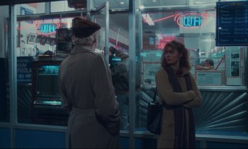 Movie still from “Atlantic City” (1980), directed by Louis Malle – Two women are standing in front of a store window; Wide shot, Over the shoulder angle