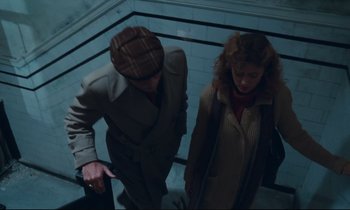 Movie still from “Atlantic City” (1980), directed by Louis Malle – A man and a woman walking up a flight of stairs; Medium shot, Overhead angle