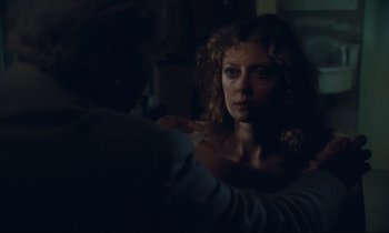 Movie still from “Atlantic City” (1980), directed by Louis Malle – A woman looking at a man in a dark room; Close Up shot, Over the shoulder angle