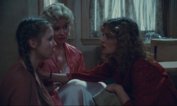 Movie still from “Atlantic City” (1980), directed by Louis Malle – A group of women sitting on top of a couch; Medium shot, Over the shoulder angle