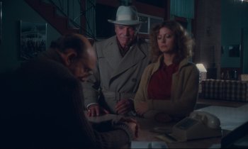 Movie still from “Atlantic City” (1980), directed by Louis Malle – A group of people sitting around a table; Medium shot, Over the shoulder angle