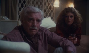 Movie still from “Atlantic City” (1980), directed by Louis Malle – An older man sitting next to an older woman; Medium shot, Low angle