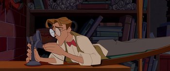 Movie still from “Atlantis: The Lost Empire” (2001), directed by Gary Trousdale – A man sitting on a table with a book in front of him; Medium shot, High angle