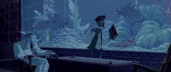 Movie still from “Atlantis: The Lost Empire” (2001), directed by Gary Trousdale – A man is holding a book in front of a fish tank; Medium shot, High angle