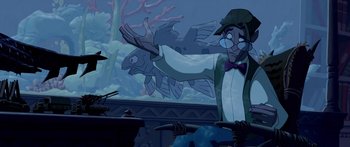 Movie still from “Atlantis: The Lost Empire” (2001), directed by Gary Trousdale – An image of an animated character with a fish in the background; Medium shot, Over the shoulder angle
