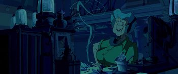 Movie still from “Atlantis: The Lost Empire” (2001), directed by Gary Trousdale – An old man sitting at a table in front of a fireplace; Medium shot, Low angle