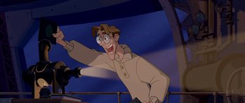 Movie still from “Atlantis: The Lost Empire” (2001), directed by Gary Trousdale – A man with glasses and a brown jacket is smiling; Medium shot, Low angle