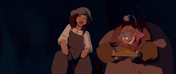 Movie still from “Atlantis: The Lost Empire” (2001), directed by Gary Trousdale – An animated woman with a hat on and a man with a hat on; Medium shot, High angle