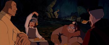 Movie still from “Atlantis: The Lost Empire” (2001), directed by Gary Trousdale – A group of people standing in a cave; Wide shot, Low angle