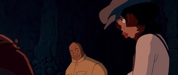 Movie still from “Atlantis: The Lost Empire” (2001), directed by Gary Trousdale – A man and a woman are looking at each other in the dark; Medium shot, Over the shoulder angle