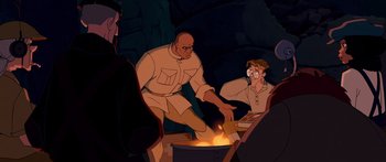 Movie still from “Atlantis: The Lost Empire” (2001), directed by Gary Trousdale – An animated scene of a man cooking something in a pot; Medium shot, Over the shoulder angle