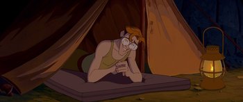 Movie still from “Atlantis: The Lost Empire” (2001), directed by Gary Trousdale – A woman laying on the ground in front of a tent; Medium shot, High angle