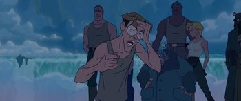 Movie still from “Atlantis: The Lost Empire” (2001), directed by Gary Trousdale – A cartoon of a man looking at something in his hand; Medium shot, High angle