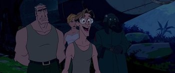 Movie still from “Atlantis: The Lost Empire” (2001), directed by Gary Trousdale – A group of people standing next to each other in the dark; Medium shot, Low angle