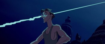 Movie still from “Atlantis: The Lost Empire” (2001), directed by Gary Trousdale – A man with glasses is standing in front of a building; Medium shot, Low angle