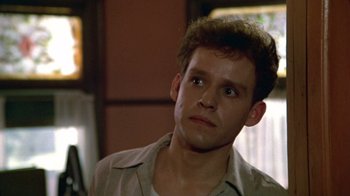 Movie still from “Sophie's Choice” (1982), directed by Alan J. Pakula – A man with a beard is looking to his left; Close Up shot, Low angle