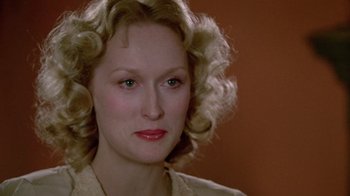 Movie still from “Sophie's Choice” (1982), directed by Alan J. Pakula – A person with blonde hair; Close Up shot, Over the shoulder angle