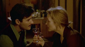 Movie still from “Sophie's Choice” (1982), directed by Alan J. Pakula – A man and a woman are drinking wine; Close Up shot, Over the shoulder angle