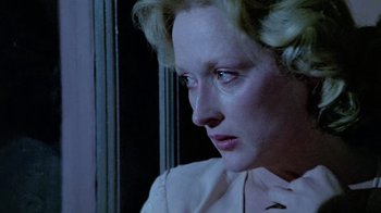 Movie still from “Sophie's Choice” (1982), directed by Alan J. Pakula – A person looking down at a window; Close Up shot, Low angle