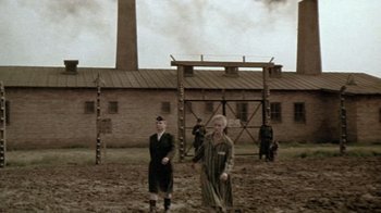 Movie still from “Sophie's Choice” (1982), directed by Alan J. Pakula – A group of people standing in a field; Wide shot, High angle