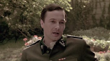 Movie still from “Sophie's Choice” (1982), directed by Alan J. Pakula – A person wearing a military uniform; Close Up shot, Low angle