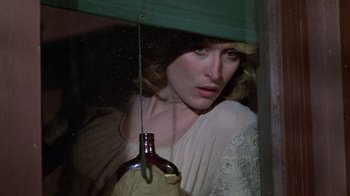Movie still from “Sophie's Choice” (1982), directed by Alan J. Pakula – A woman in a white dress looking out of a window; Close Up shot, High angle