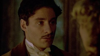 Movie still from “Sophie's Choice” (1982), directed by Alan J. Pakula – A person wearing a suit and tie; Close Up shot, High angle