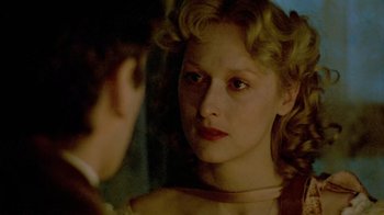 Movie still from “Sophie's Choice” (1982), directed by Alan J. Pakula – A woman looking at a man in a mirror; Close Up shot, Over the shoulder angle